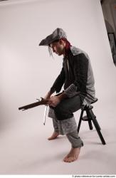 JACK PIRATE SITTING POSE WITH GUN AND DAGGER